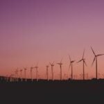 Silhouetted wind turbines at sunset in Zahara de los Atunes, Spain.